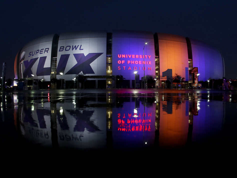 Football pundits say could be one of the closest, most exciting championship games ever. (Charlie Riedel/AP)