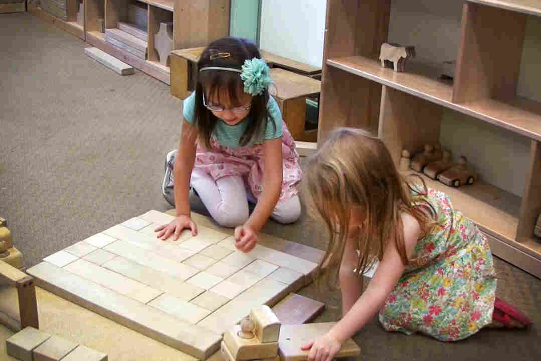 Two girls play with blocks at Bing Nursery School at Stanford University.