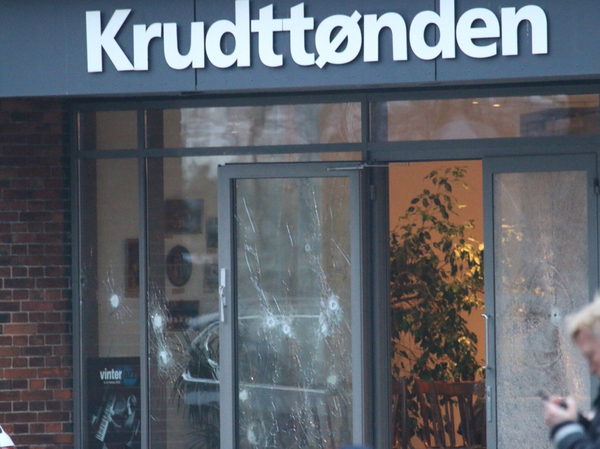 Damaged glass is seen at the site of a shooting in Copenhagen on Saturday. Shots were fired near a meeting in the Danish capital that was attended by controversial Swedish artist Lars Vilks.