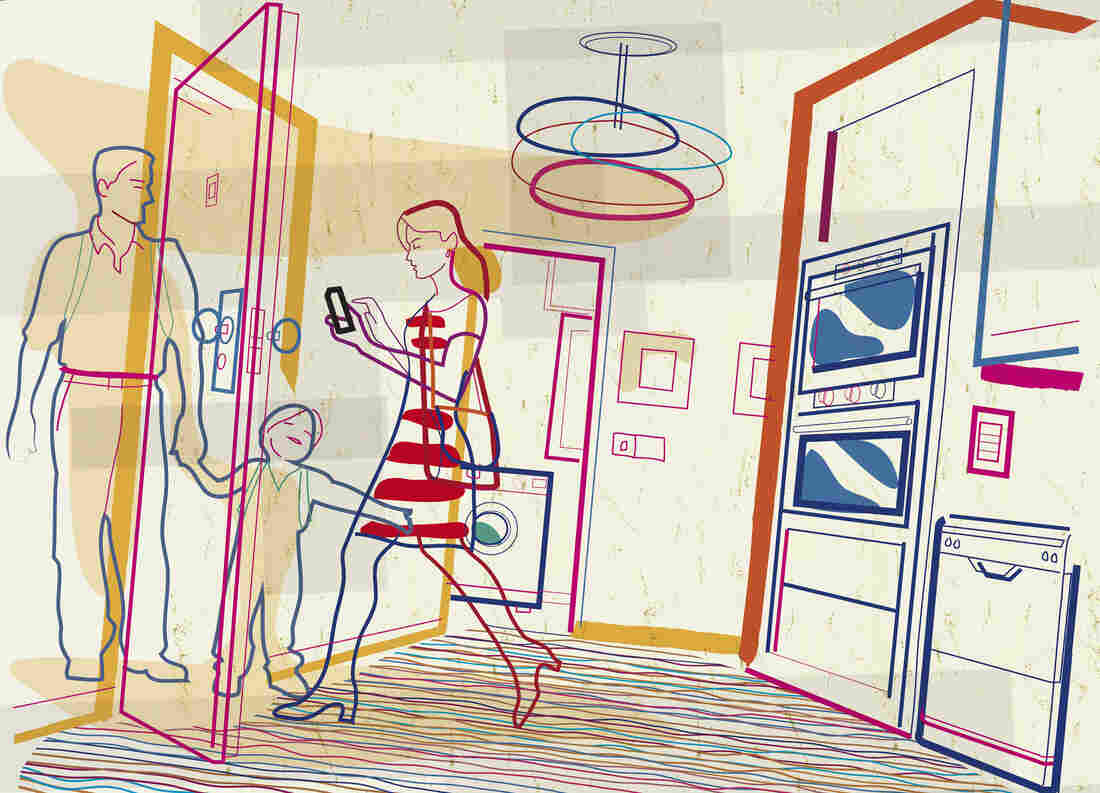 Woman leaving house with family checking smartphone.