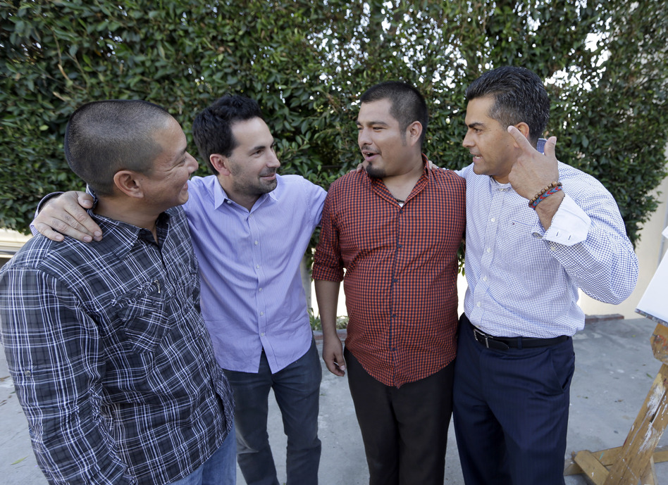 Scott Budnick (second from left) stands with (from left) Jimmy Wu, who served 16 years in prison and is now a mentor; Jesse Aguiar, former gang member and now a counselor; and Franky Carrillo, who was freed by the Innocence Project after 21 years in prison. (Reed Saxon/AP)