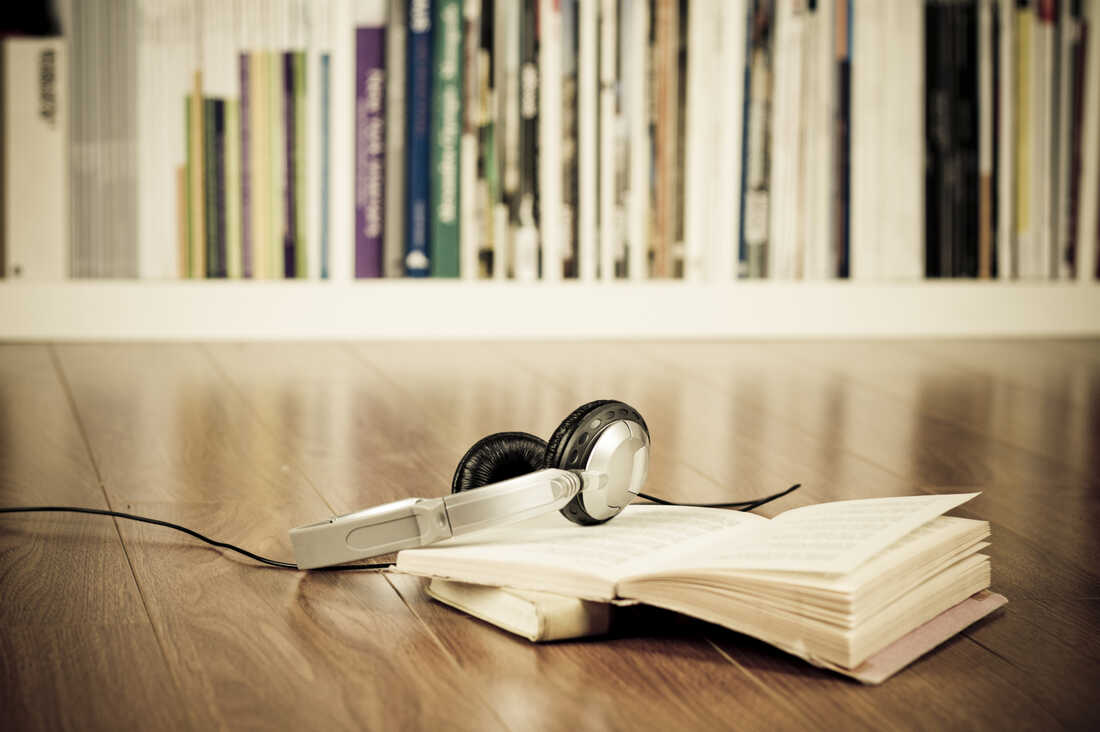 Headphones on top of a book