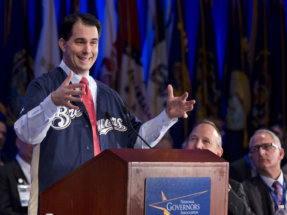 At this stage in the election cycle, just like in baseball's spring training, fans love to see a new phenom catch fire. Wisconsin Gov. Scott Walker, sporting a Milwaukee Brewers jersey in 2013, seems to be the rookie to watch in the 2016 presidential race so far. (Manuel Balce Ceneta/AP)