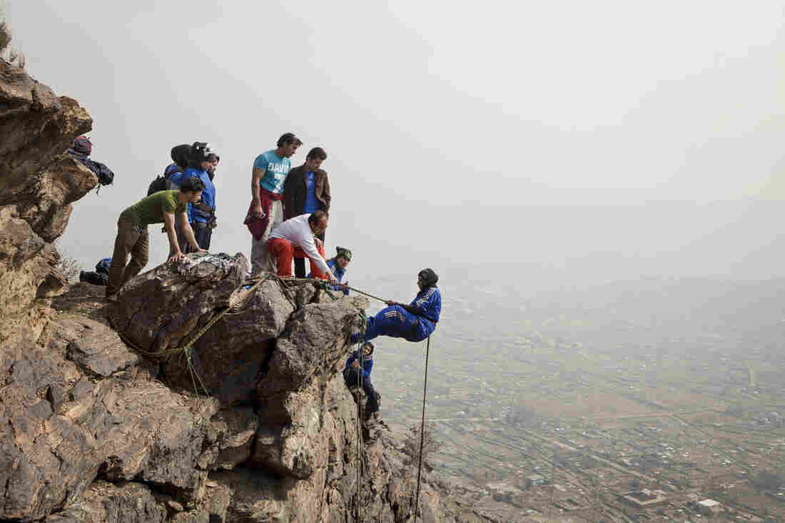 Eighteen-year-old Zahra Karimi Nooristani dangles precariously off a rock face high above Kabul.