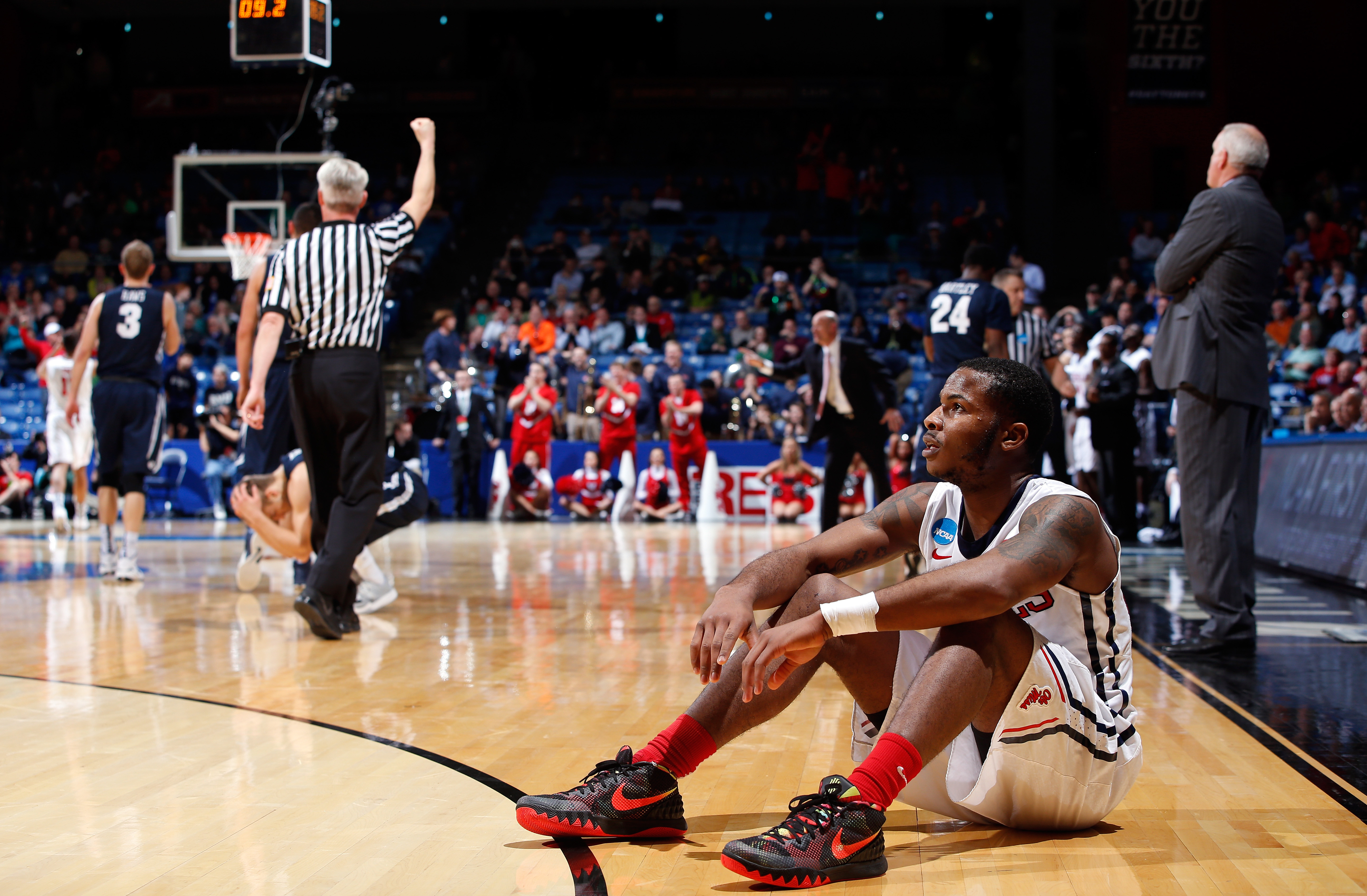 Jarvis Summers of the Mississippi Rebels sits on the court in the closing seconds of his team's 17-point comeback win against Brigham Young during the first round of the 2015 NCAA Men's Basketball Tournament. (Getty Images)