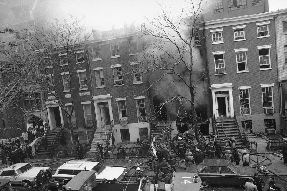 New York City firefighters work to put out a fire caused by explosions at 18 W. 11th St. on March 6, 1970. It was later discovered that the Weathermen, a radical left-wing organization, had been building bombs in the building's basement. (Marty Lederhandler/AP)