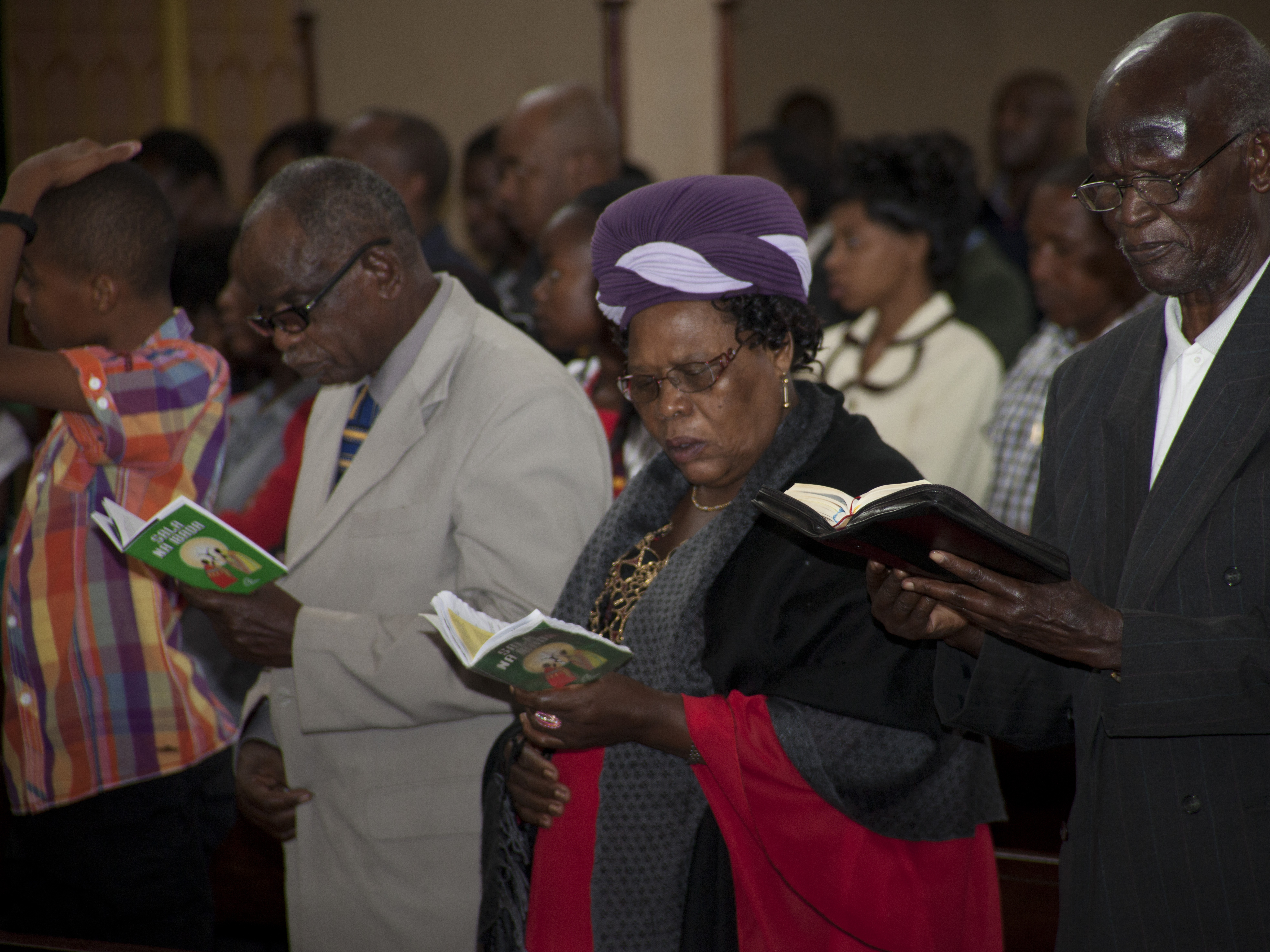 Kenyan Christians pray as they join a morning service at Holy Family Basilica in Nairobi, Kenya, on Sunday.