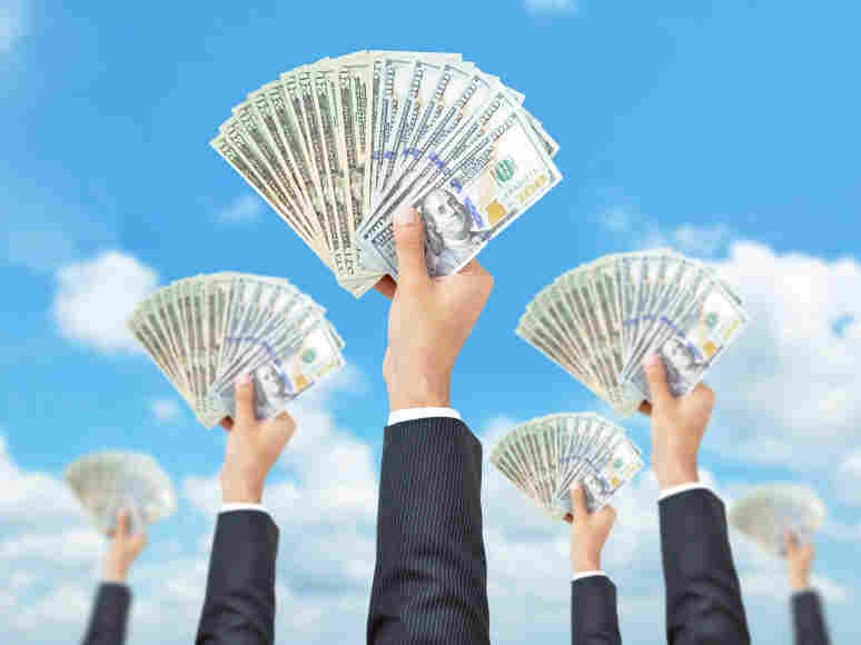 Hands holding money - United States dollar (USD) banknotes - money raising, funding & consumerism concept