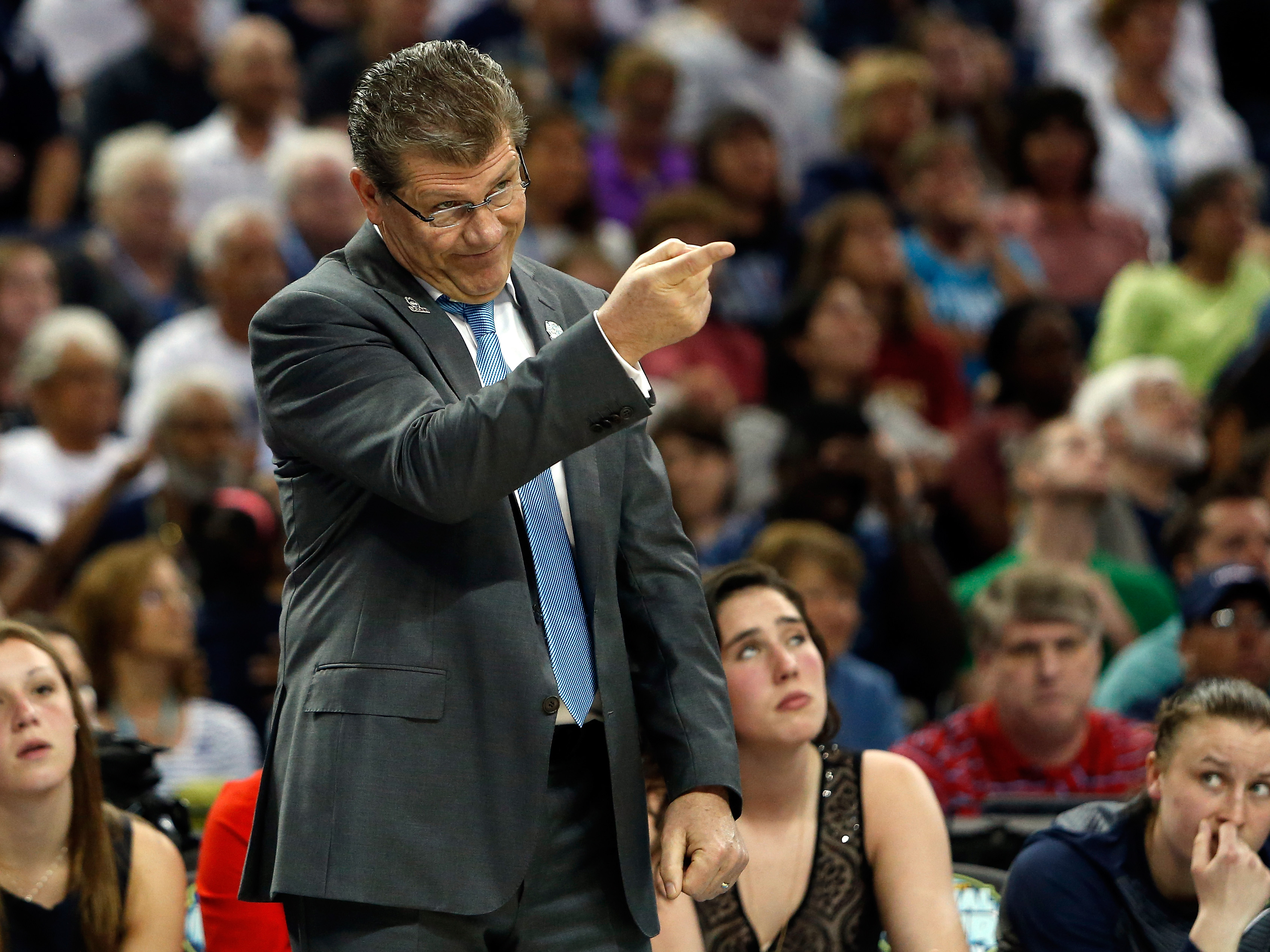 Head coach Geno Auriemma of the Connecticut Huskies calls to his players in the first half against the Notre Dame Fighting Irish.