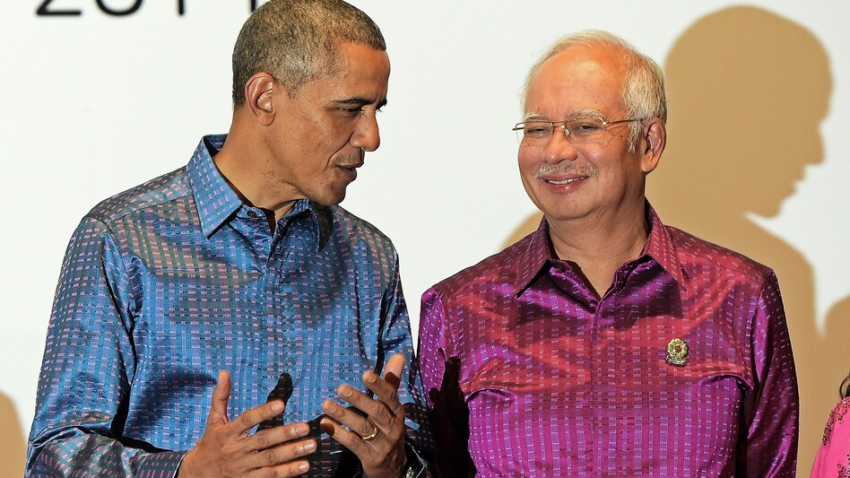 President Obama talks with Malaysian Prime Minister Najib Razak at the East Asia Summit in Myanmar in November. Obama is trying to strike a 12-country Trans-Pacific Partnership, which would include Malaysia. (Christophe Archambault/AFP/Getty Images)