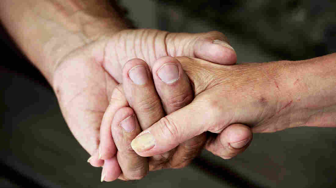 Couple holding hands.