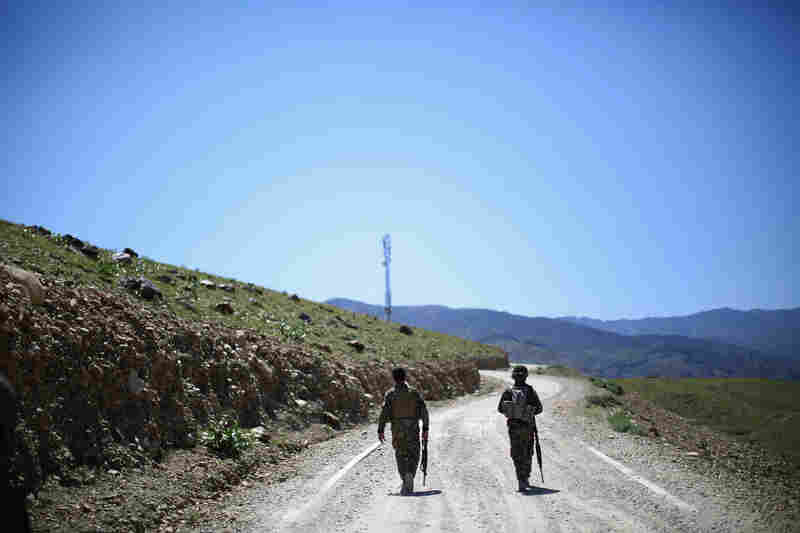 Afghan army soldiers head up a road in Nangahar Province, where Taliban fighters are attacking a police checkpoint that is under construction. The Afghan military is much more active in the fight compared to a couple of years ago, when troops hung back on patrols and let the Americans lead.