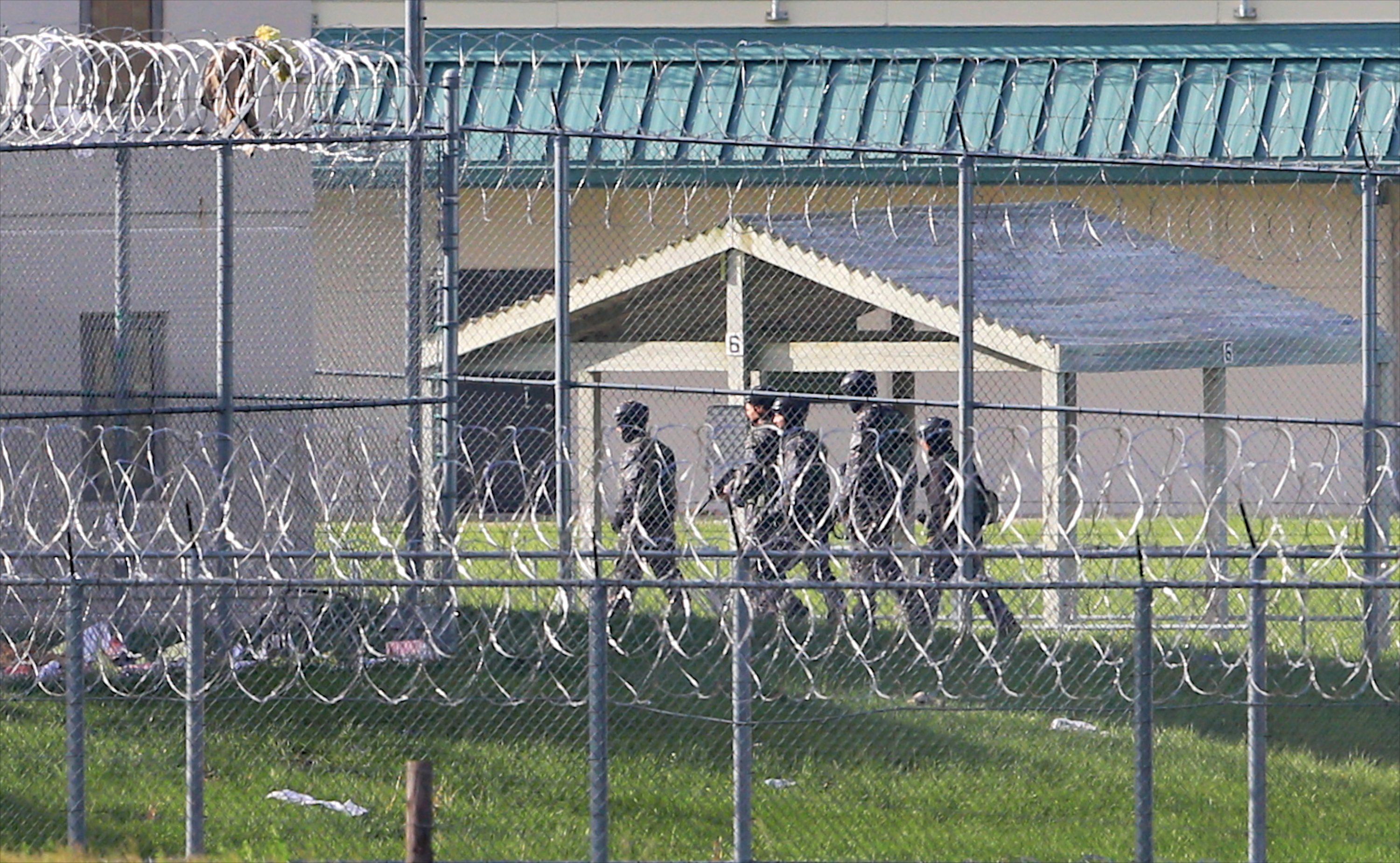 Armed personnel patrol the grounds of the Tecumseh State Correctional Institution, in Tecumseh, Neb., on Monday.