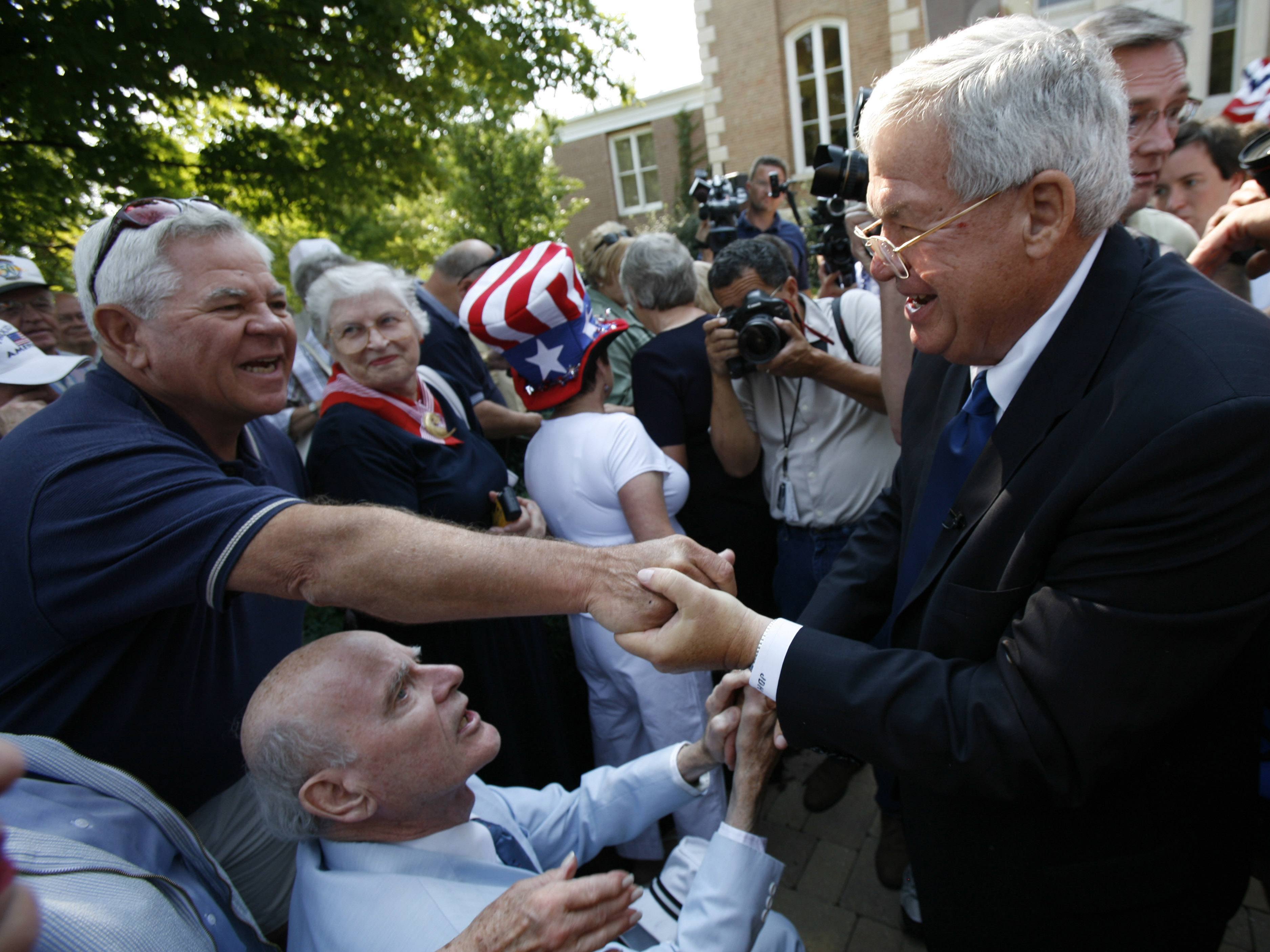 Then-U.S. Rep. Dennis Hastert greets a supporter in Yorkville, Ill., in August 2007, after he announced that he would not seek another term in Congress. Hastert was indicted May 28 on charges of evading cash-withdrawal reporting requirements and lying to the FBI, in connection with what the indictment described as $3.5 million in hush money slowly taken out and paid to an unnamed individual.