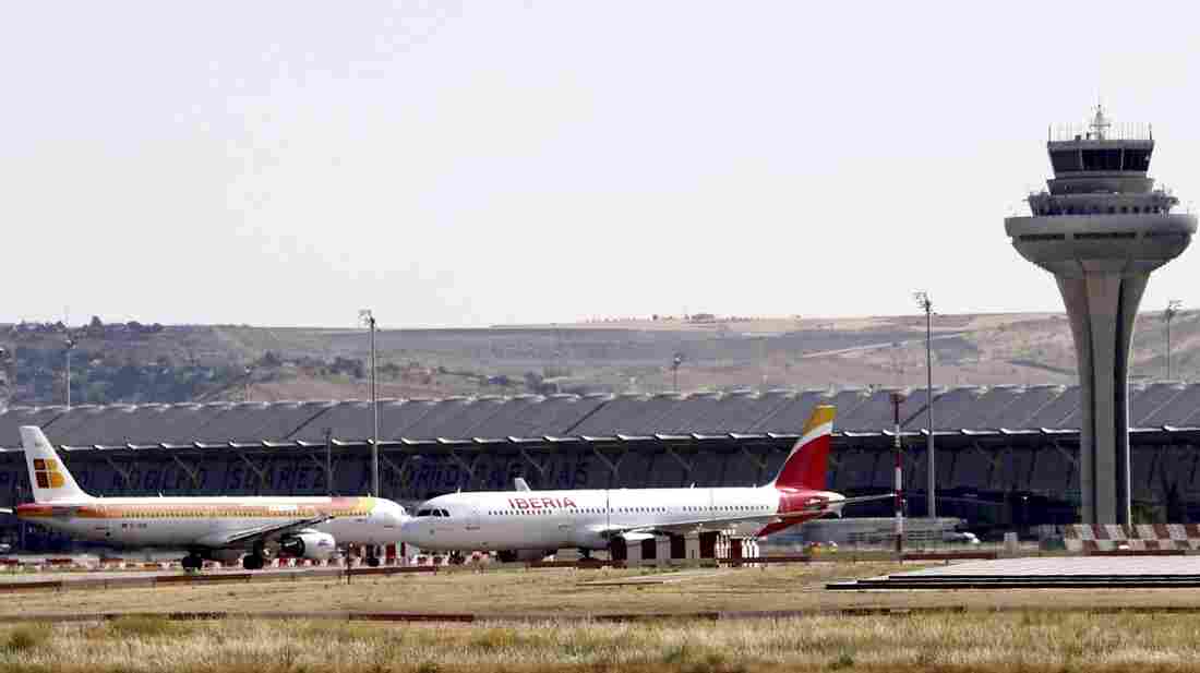 Two Spanish Iberia airplanes stand on the the tarmac at the Adolfo Suarez Madrid-Barajas airport in Madrid Monday. Spanish air traffic controllers started a four-day partial strike that could affect some 5,300 flights.