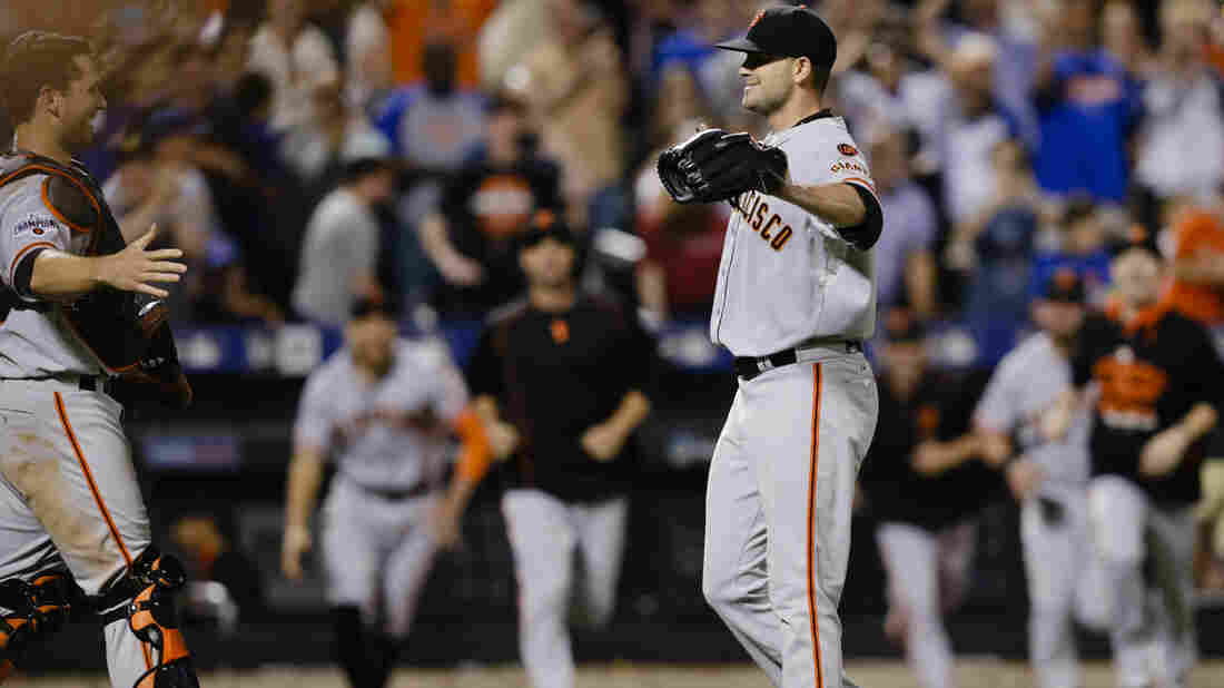 San Francisco Giants catcher Buster Posey prepares to embrace Chris Heston after Heston threw a no-hitter against the New York Mets Tuesday in New York. The Giants won 5-0.