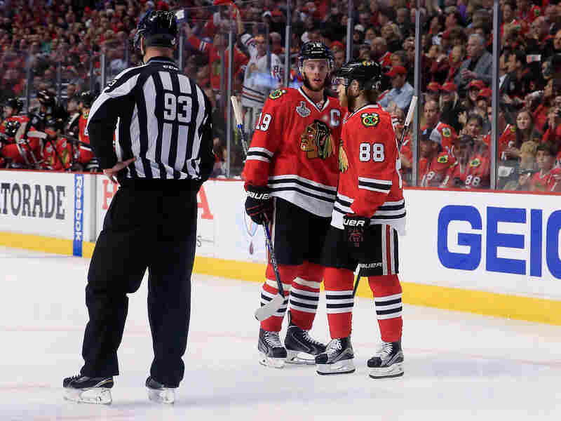 Chicago Blackhawks Jonathan Toews (19) and Patrick Kane (88) confer during Monday's Stanley Cup Final game against the Tampa Bay Lightning.