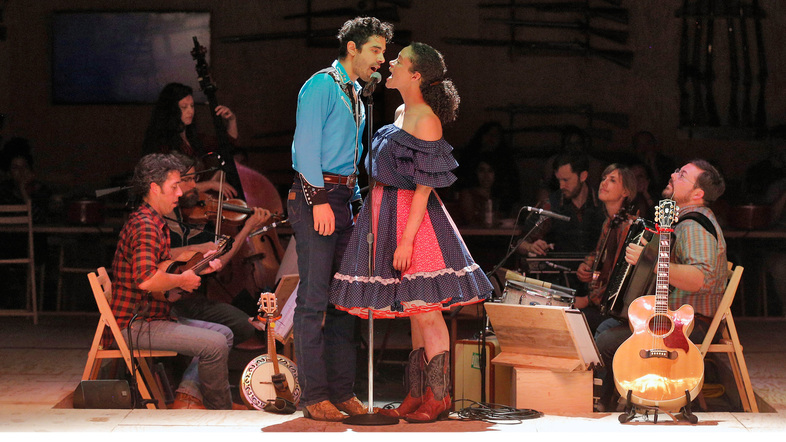 Damon Daunno (Curly) and Amber Gray (Laurey) star in director Daniel Fish's experimental retelling of Rodgers and Hammerstein's <em>Oklahoma!</em> (Cory Weaver/Courtesy of Bard College)