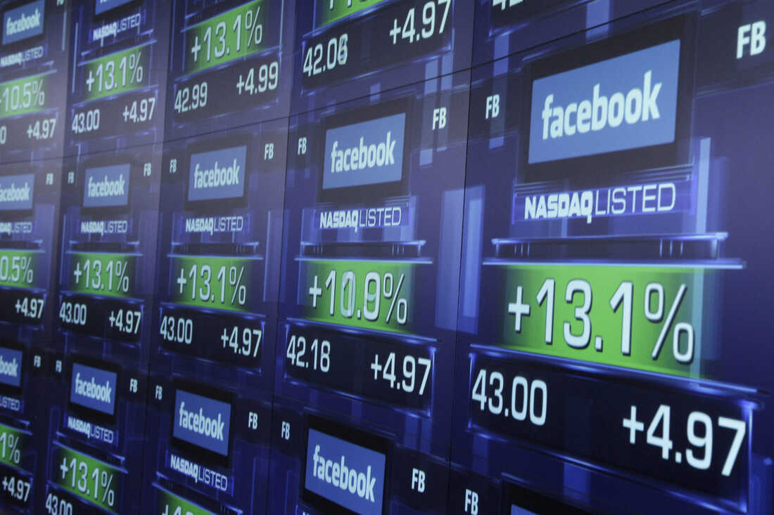 Electronic screens show the price of Facebook shares after they began trading May 18, 2012, in New York. A technical problem on the Nasdaq marred Facebook's much-heralded IPO.