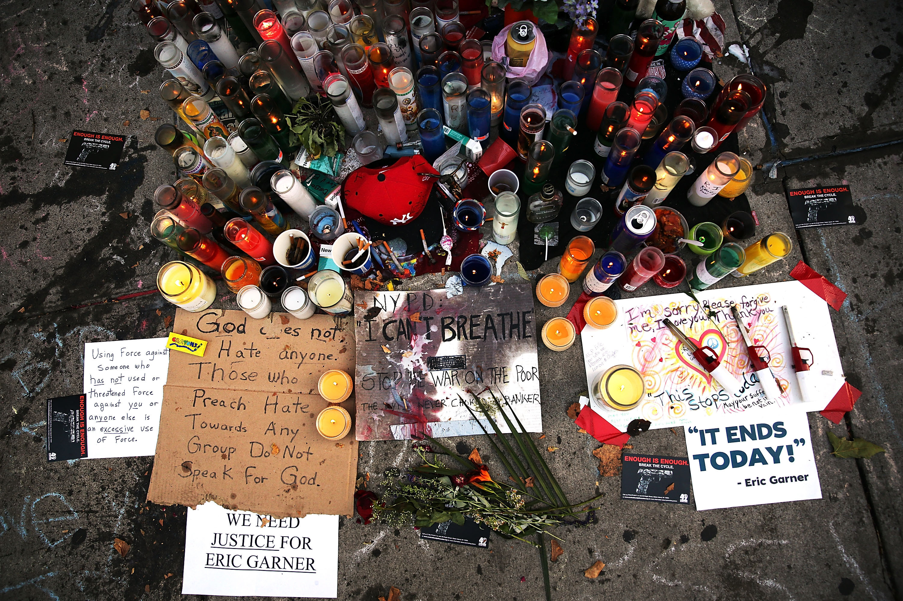 A memorial for Eric Garner, seen July 22, 2014, lies near where he died in Staten Island, N.Y. Just a few days ahead of the anniversary of his death, Garner's family has reached a settlement with New York City. (Spencer Platt/Getty Images)