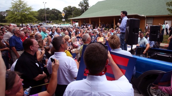 Wisconsin Gov. Scott Walker speaks to an overflow crowd in the Mutt's BBQ parking lot in Mauldin, S.C., after more than 500 showed up for his speech in Upstate South Carolina.