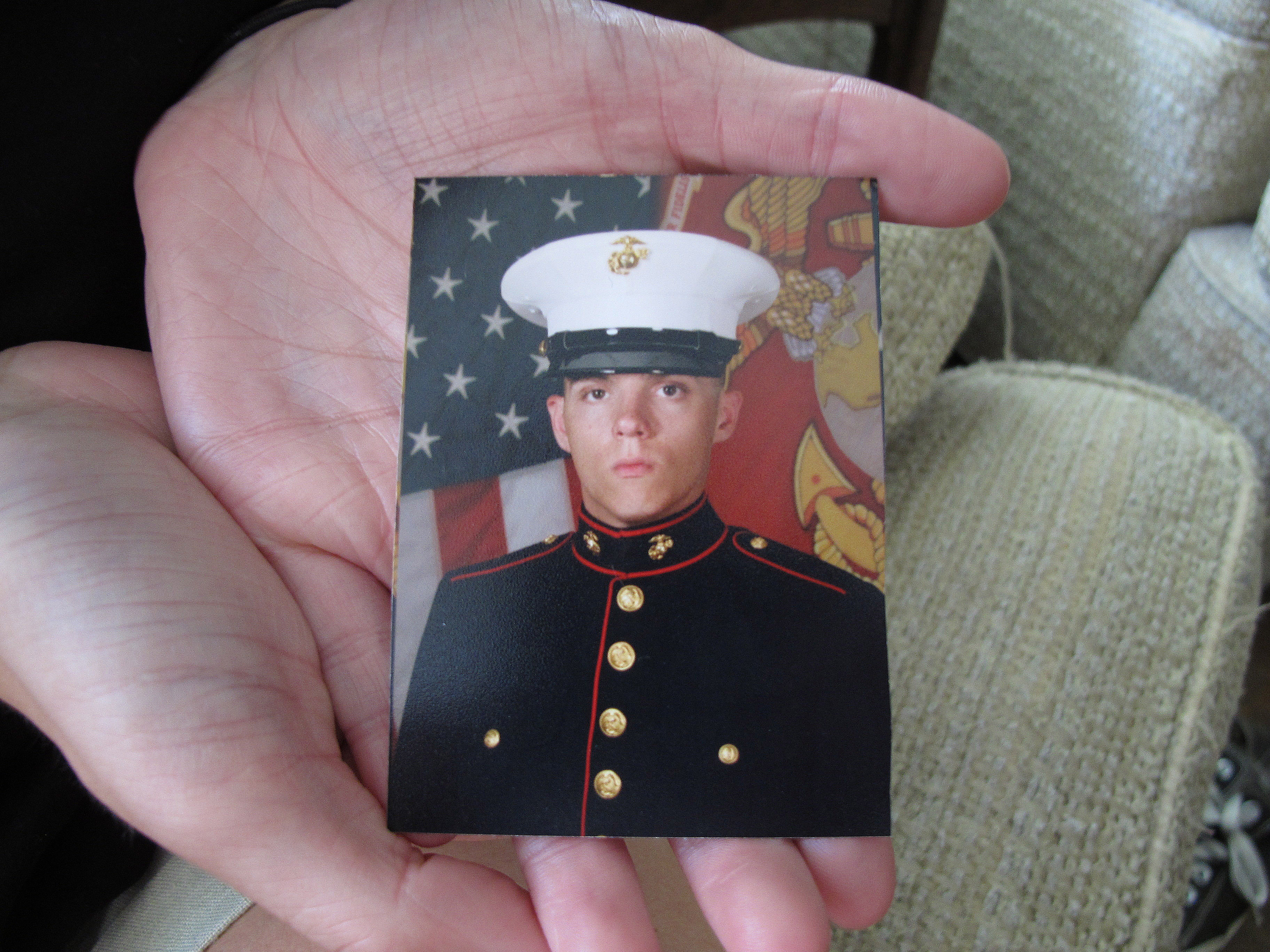 Caroline Dove holds a photo of Marine Corps Lance Cpl. Skip Wells, her boyfriend, at her home in Savannah, Ga., on Friday. Wells was among four Marines killed Thursday in Chattanooga, Tenn.