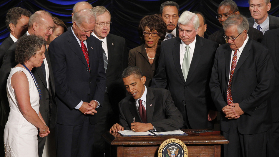 President Obama signs the Dodd-Frank financial overhaul bill in Washington on July 21, 2010. Five years later, debate over the effectiveness of the legislation continues. (Charles Dharapak/AP)