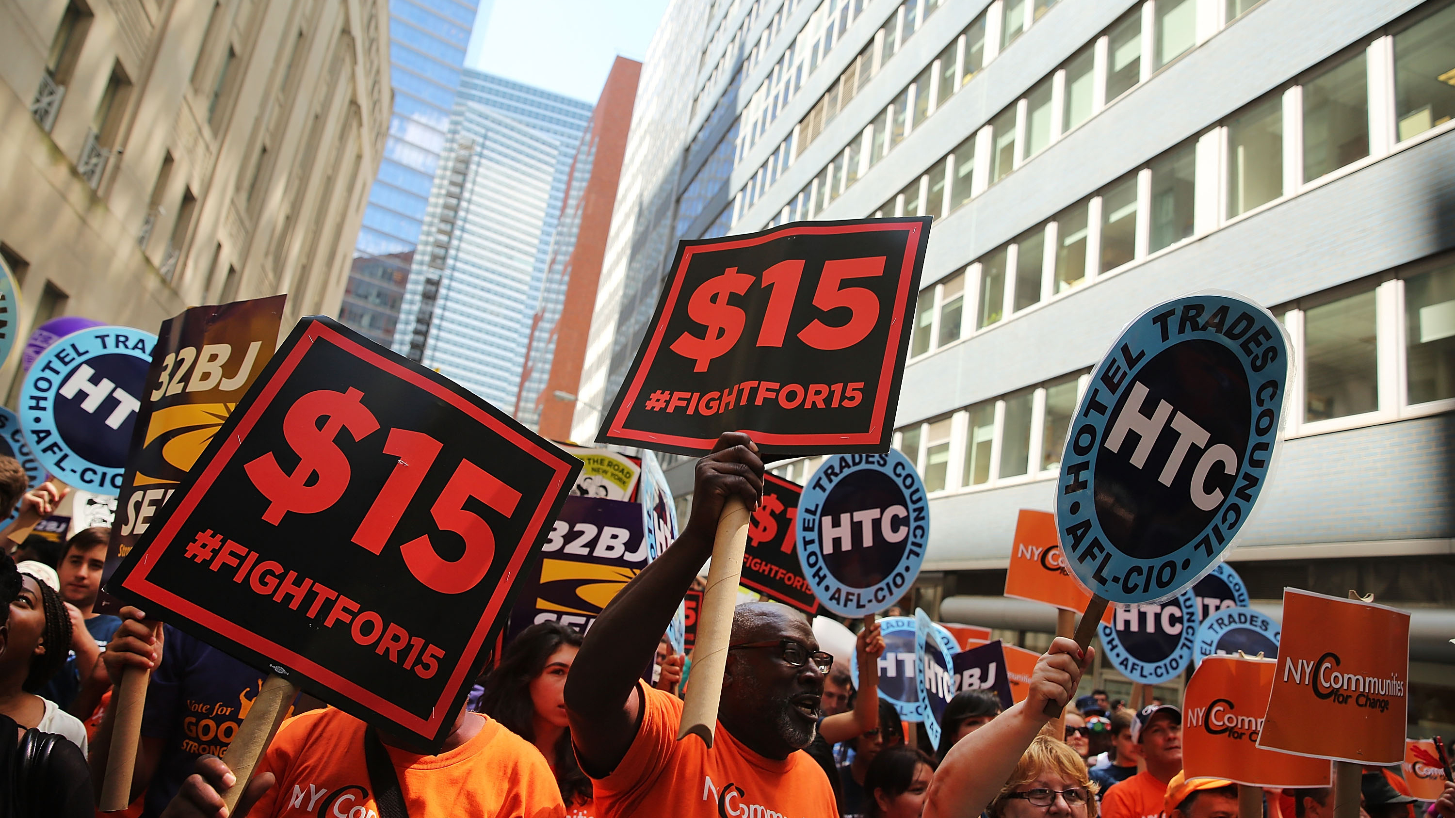 Labor leaders, workers and activists attend a rally for a $15 minimum hourly wage Wednesday in New York City. A panel appointed by Gov.  Andrew Cuomo recommended the increase. (Getty Images)