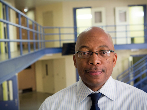 Brian Hopson, assistant superintendent at Alameda County Juvenile Hall, stands in one of its many empty units. The 360-bed facility was full when it opened eight years ago, but is now at half capacity.