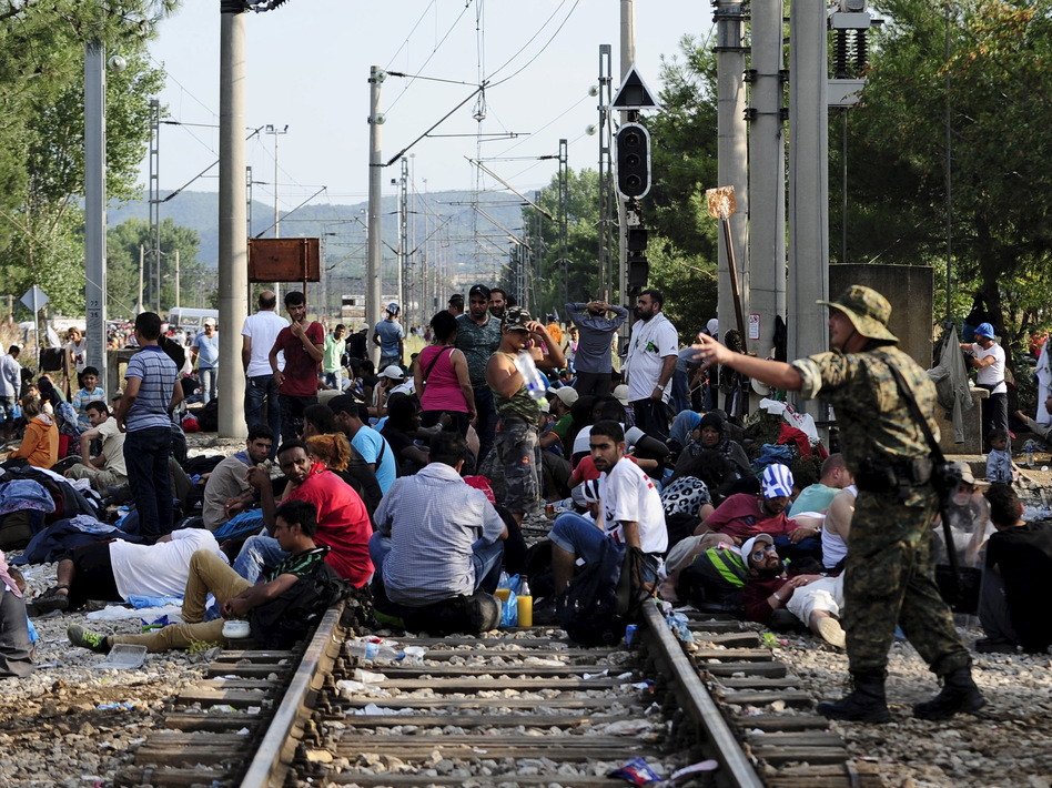 Macedonian special police guard the border as more than a thousand migrants wait at Macedonia's border with Greece. (Ognen Teofilovski/Reuters/Landov)
