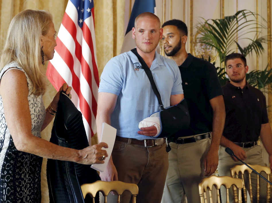 U.S. ambassador to France Jane Hartley presents U.S Airman 1st Class Spencer Stone, student Anthony Sadler and National Guardsman Alek Skarlatos at a news conference at the U.S. Embassy in Paris on Sunday. (Regis Duvignau/Reuters/Landov)