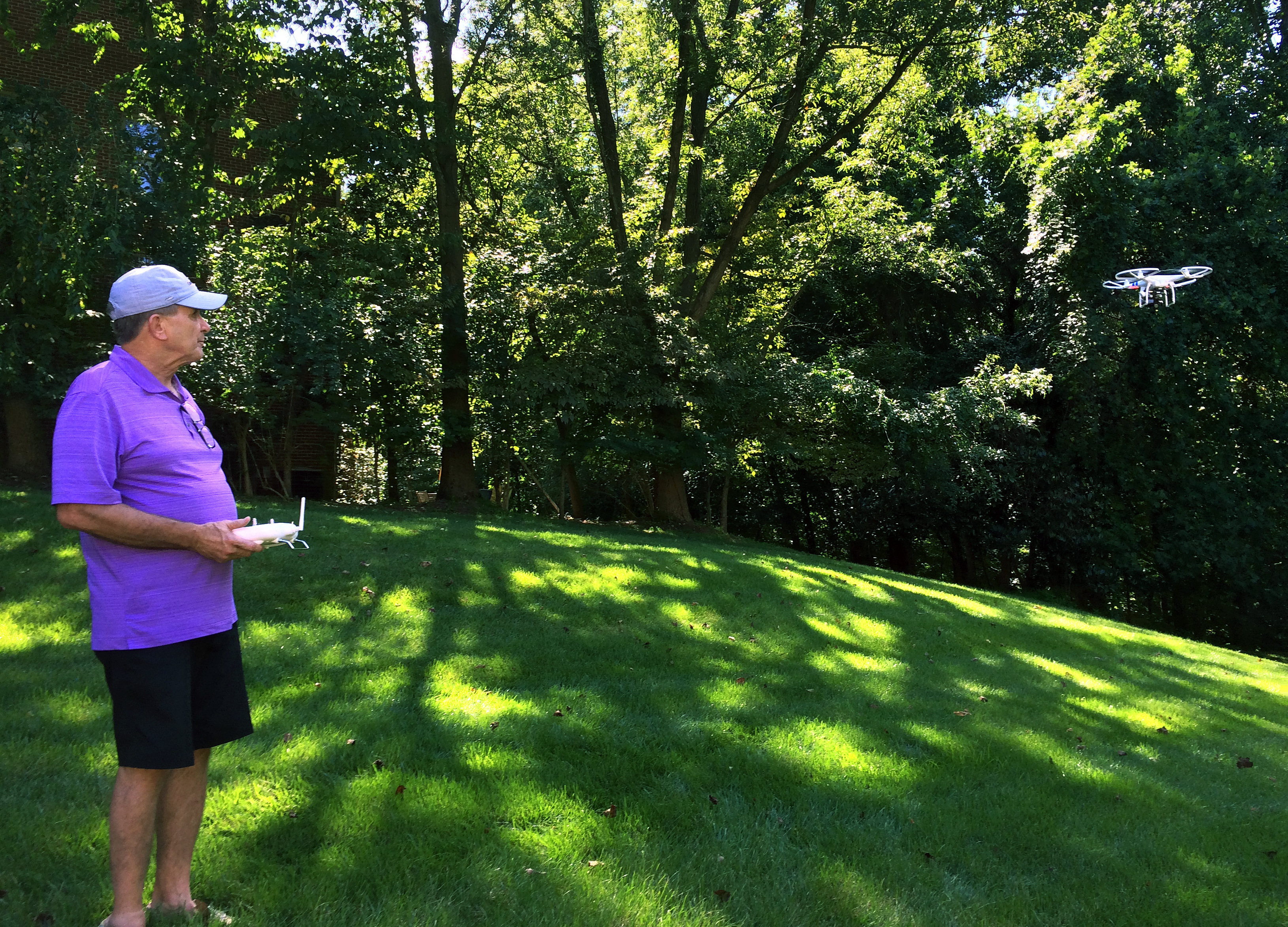 Tom Gorner, founder of Skyscape Services, flies his drone in the backyard of his Virginia home. His company uses the drone to photograph real estate for prospective buyers.