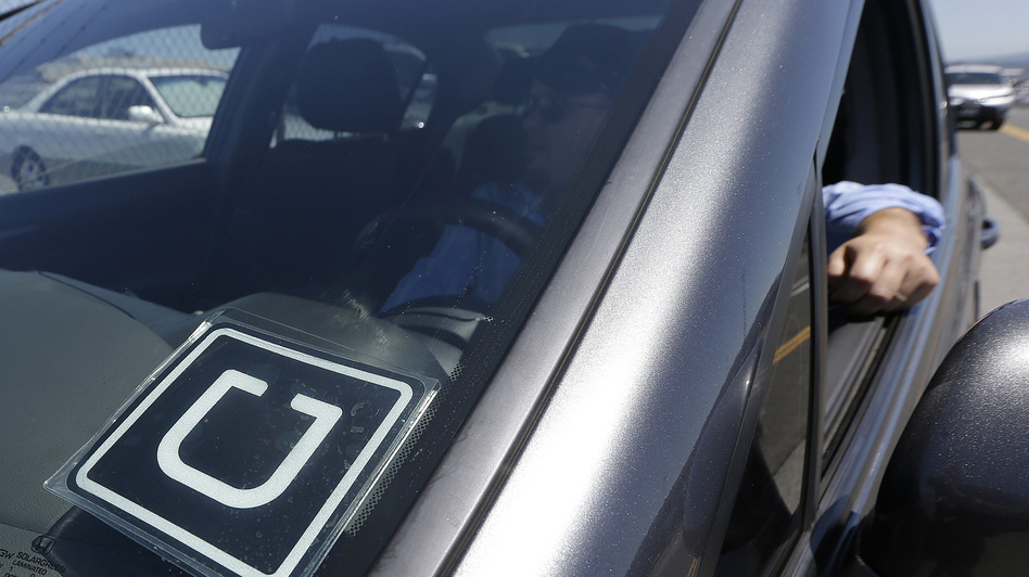 A federal judge in California has allowed some Uber drivers to proceed with a class-action suit against the company. (Jeff Chiu/AP)