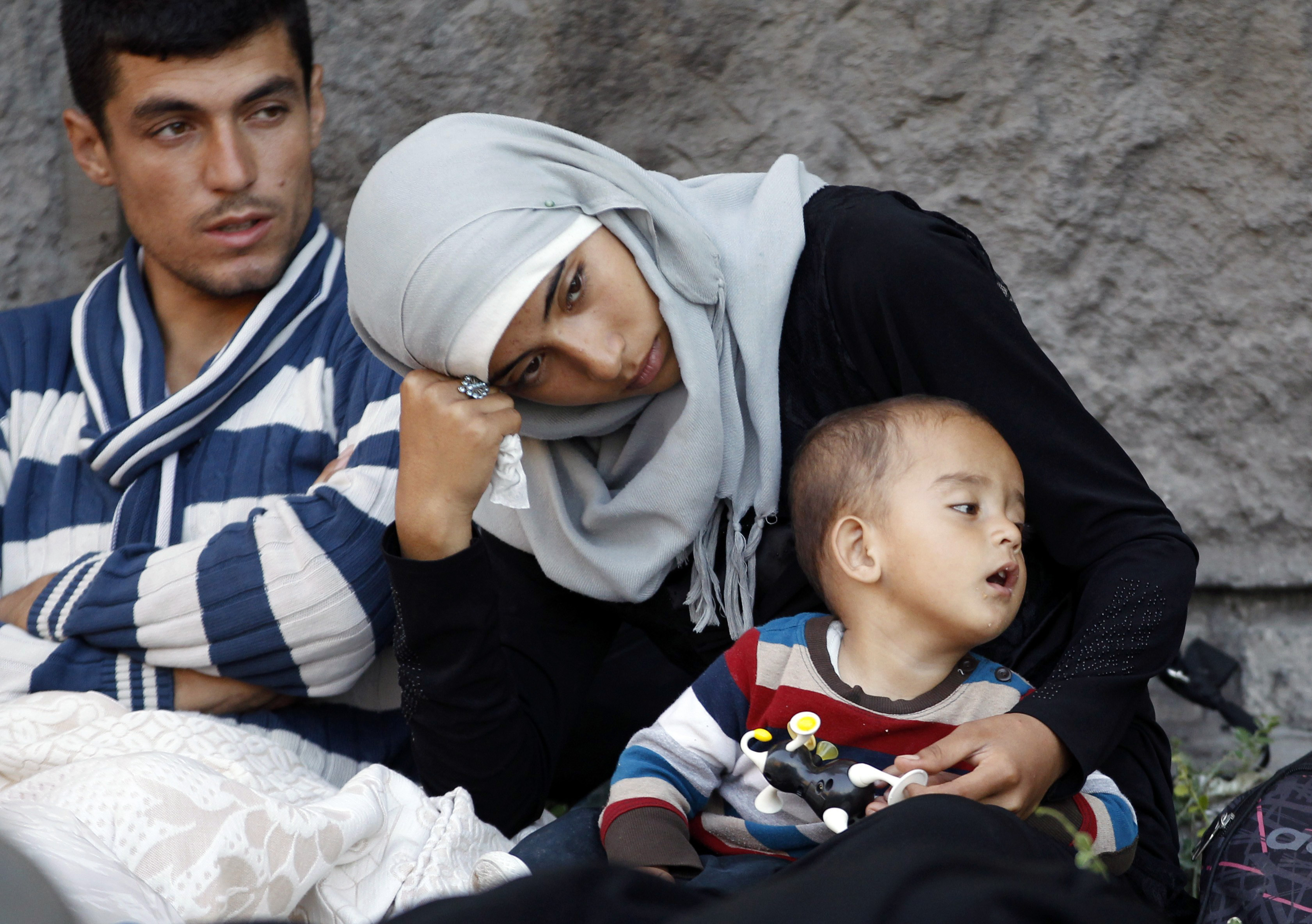 Migrants rest near the Keleti Railway Station in Budapest, Hungary, on Wednesday.