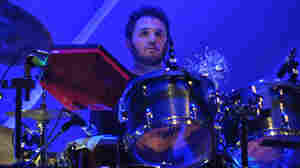 Drummer Joey Waronker stares down his own kit during a live performance with the band Atoms For Peace.