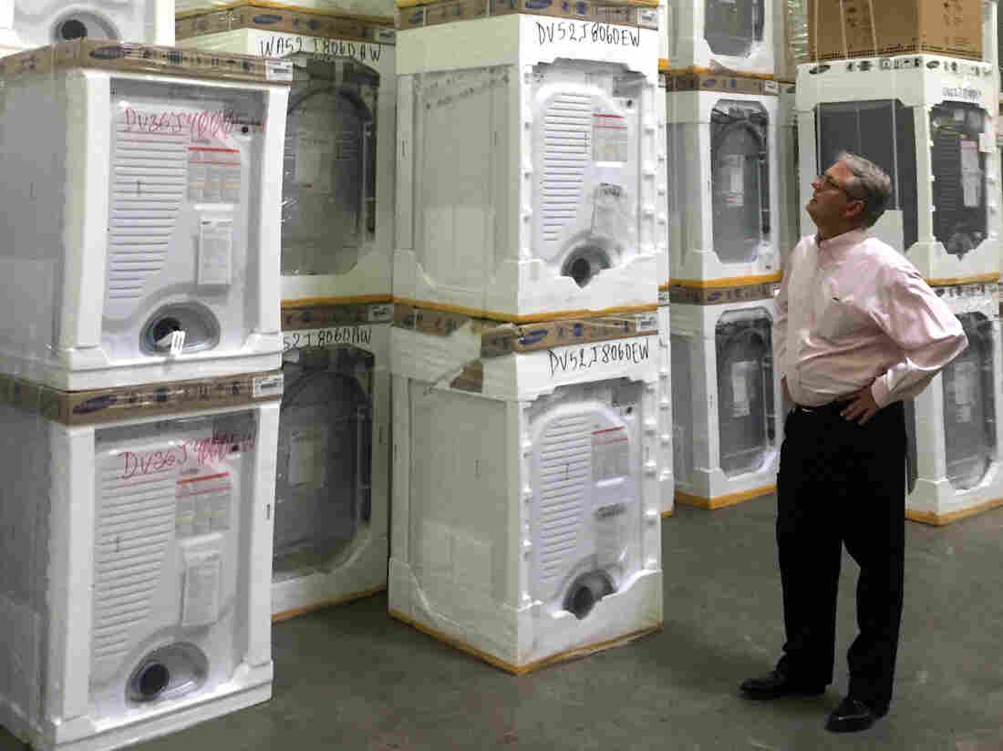 Roddey Player, CEO of Queen City Appliances surveys his stock.