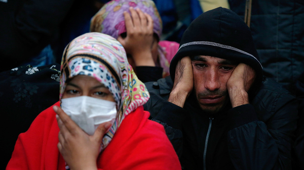 Syrian migrants at a train station in Keleti, Hungary, wait for a train bound for Munich, Germany, on Wednesday. As more migrants reach Germany, it is encouraging more in the Middle East to make the journey, according to some aid workers.