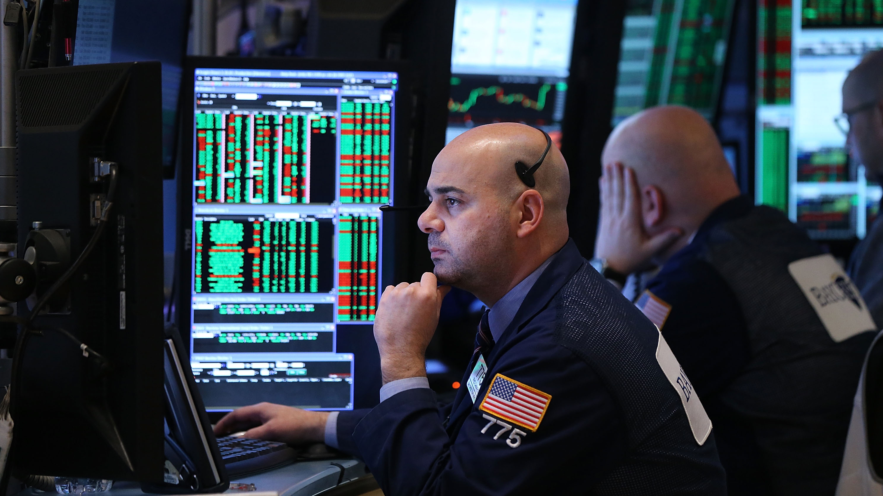 Traders work on the floor of the New York Stock Exchange in March. Investors have been waiting to see whether the Federal Reserve will raise interest rates for the first time since 2006.