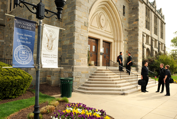 Seminarians greet each other outside Theological College, the national seminary of The Catholic University of America in Washington, D.C.