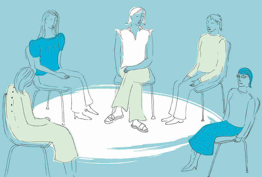 Women sitting together in a circle in a support group.