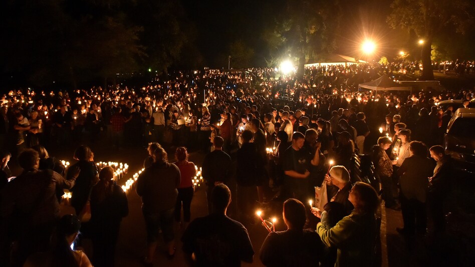 Hundreds of people gathered for a vigil in Roseburg, Ore., Thursday night, after 10 people died and seven others were wounded in a shooting at the local community college. (Josh Edelson/AFP/Getty Images)