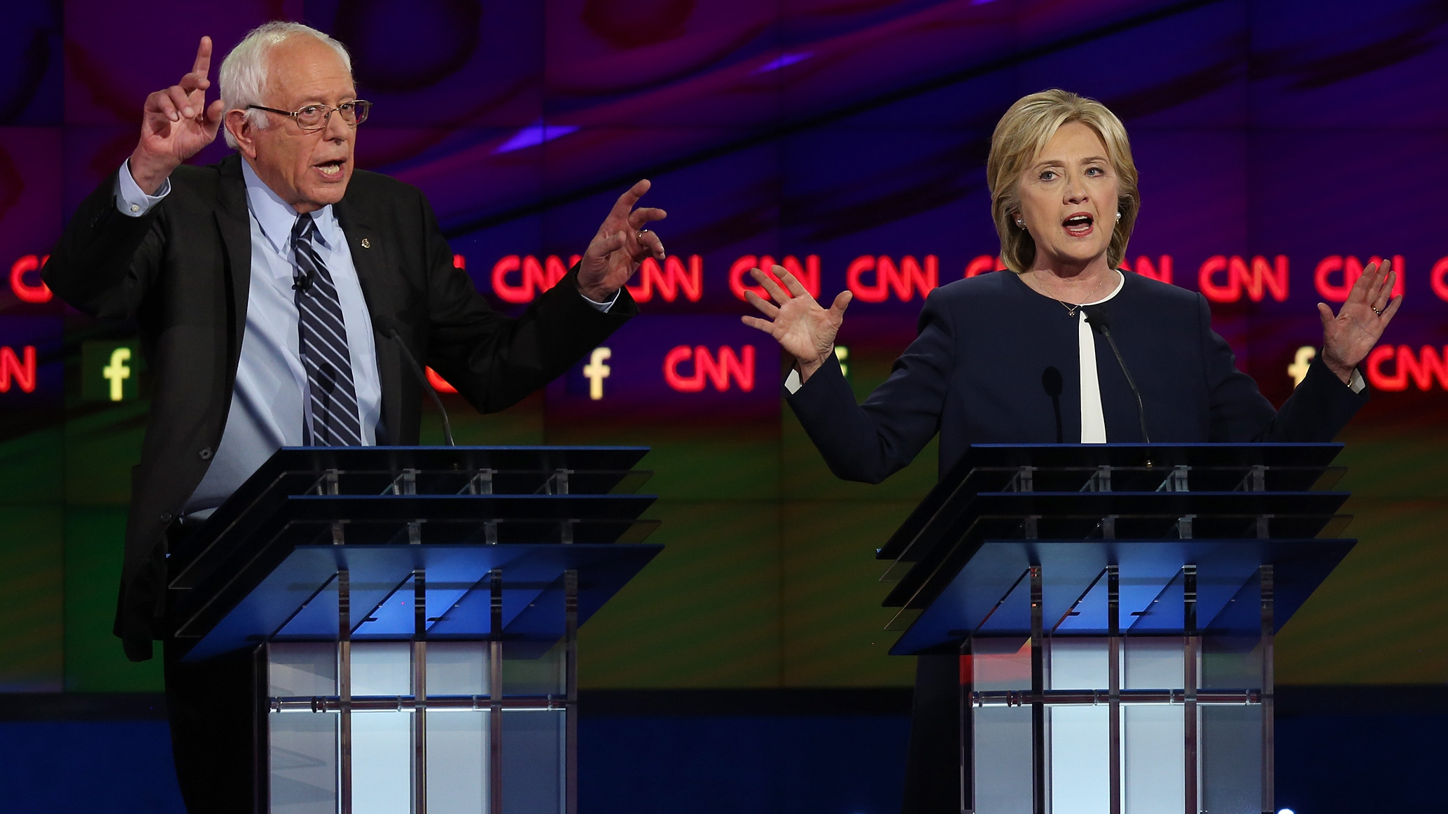 Democratic presidential candidates Sen. Bernie Sanders and Hillary Clinton on stage at the presidential debate Tuesday. (Getty Images)