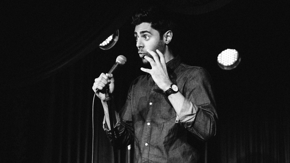 Hasan Minhaj performs in his new one-man show &quot;Homecoming King&quot;. (Courtesy of Hasan Minhaj: Homecoming King)