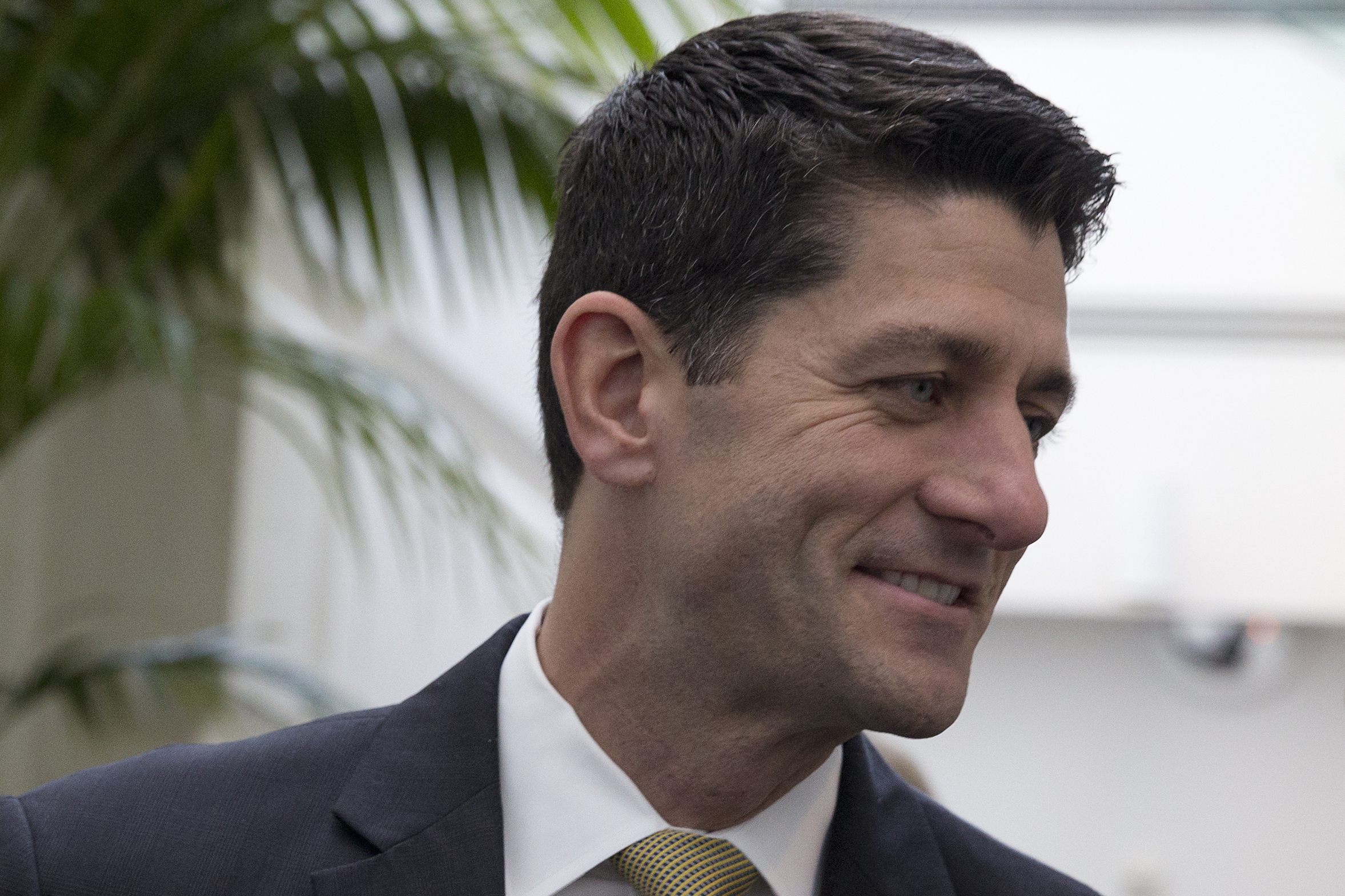 Rep. Paul Ryan leaves a caucus meeting on Capitol Hill on Wednesday.
