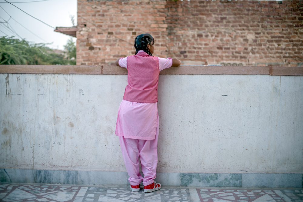 Nimmu, 15, on the terrace of the Veerni Institute. To stay in school, she needs to pass a national test this March. The problem: &quot;I'm not a great student,&quot; she says. Because child marriage is illegal in India, we can't use her full name. (VII Photo)