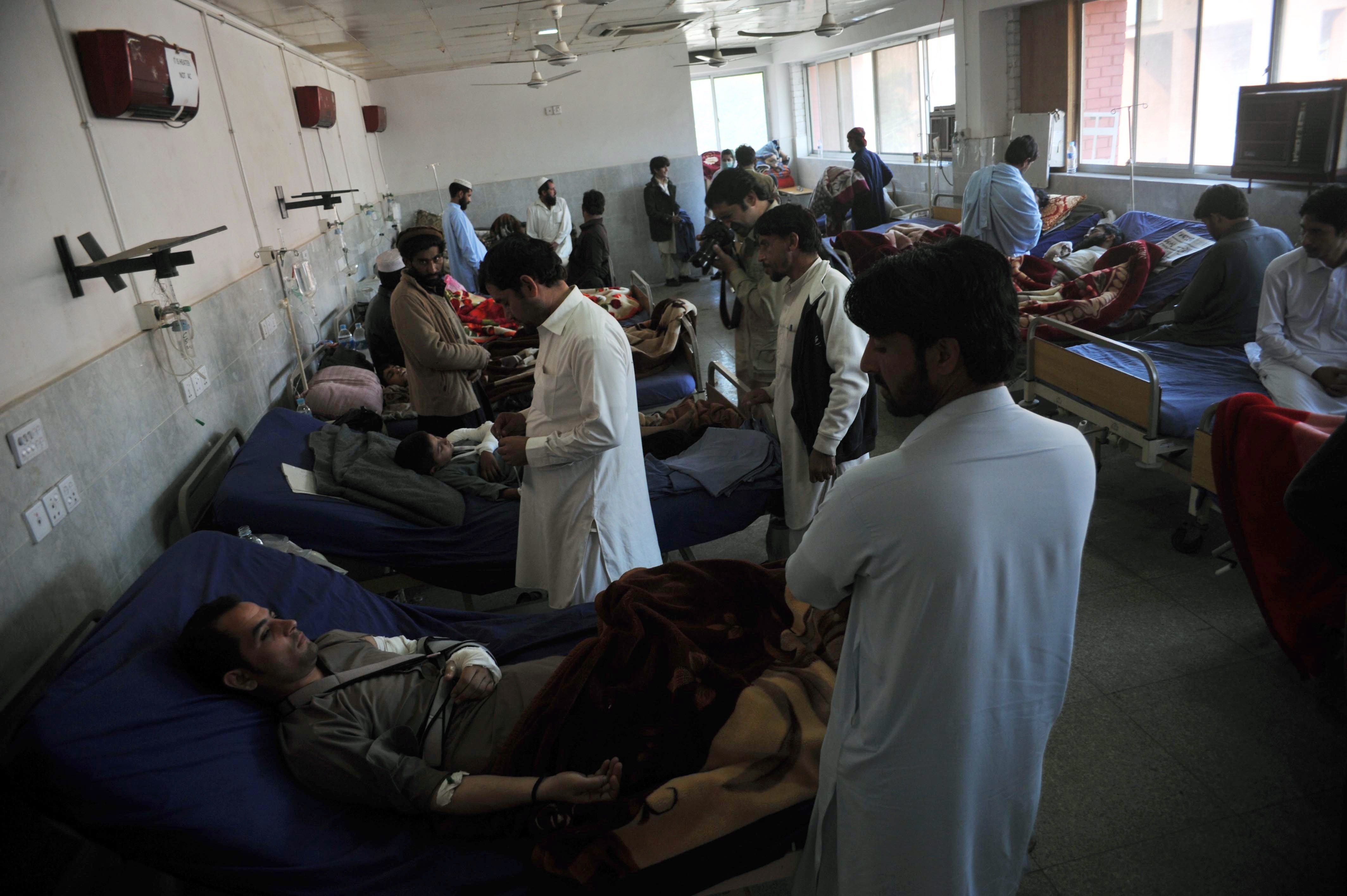 Injured Pakistanis are treated in a hospital in Peshawar on Tuesday.
