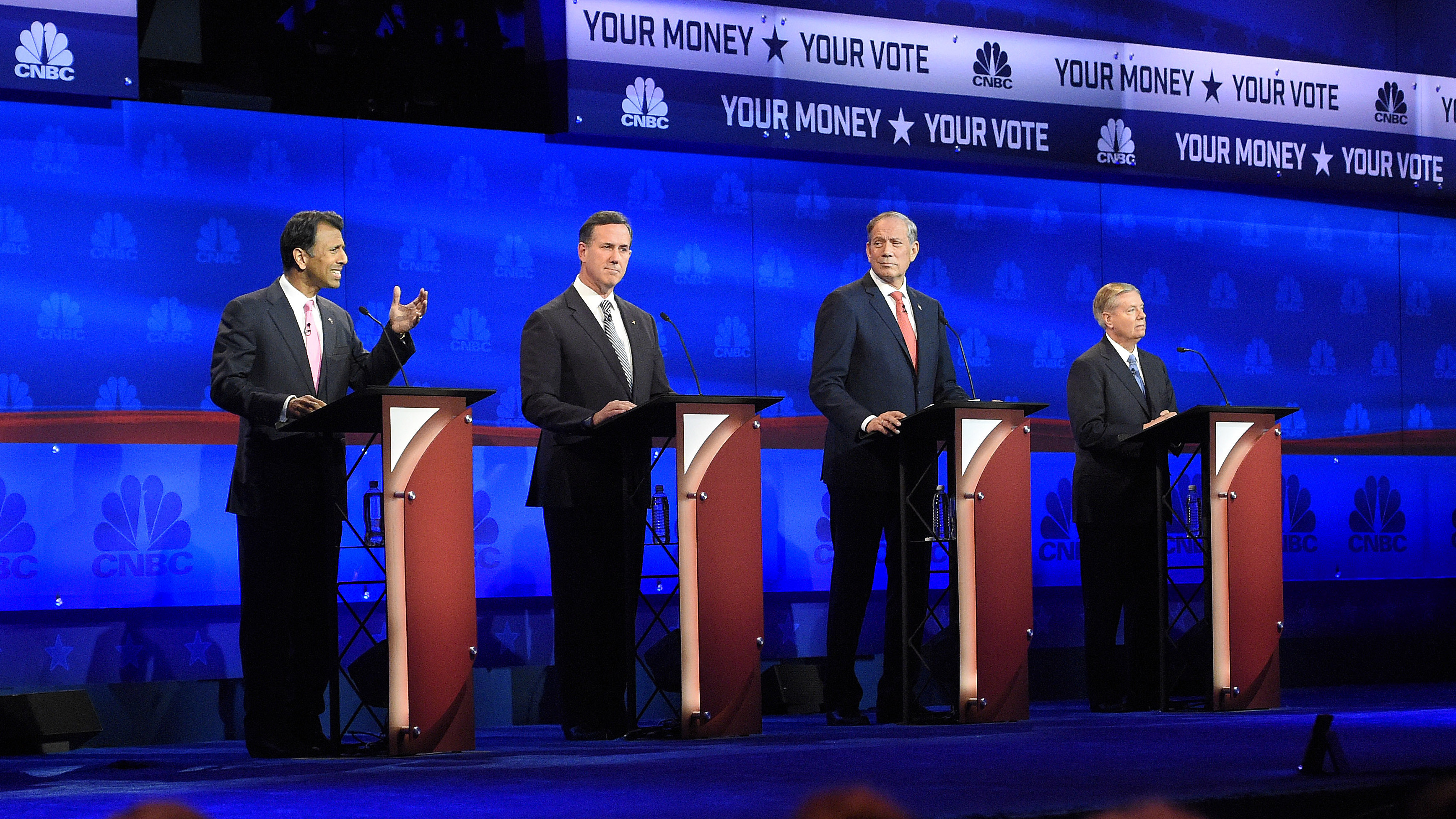 Republican presidential candidates, from left, Bobby Jindal, Rick Santorum, George Pataki, and Lindsey Graham take the stage during the CNBC Republican presidential debate at the University of Colorado on Wednesday.