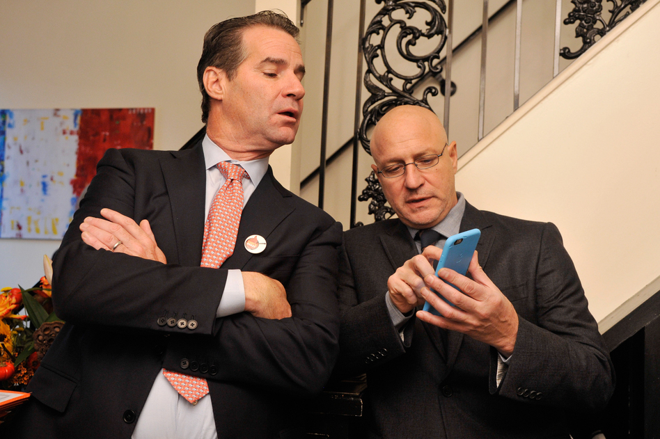 Chefs Kerry Heffernan and Tom Colicchio pose for a photo at Bearnaise, a Capitol Hill restaurant, on Tuesday before setting out for a day of lobbying lawmakers. (Kris Connor/Getty Images)
