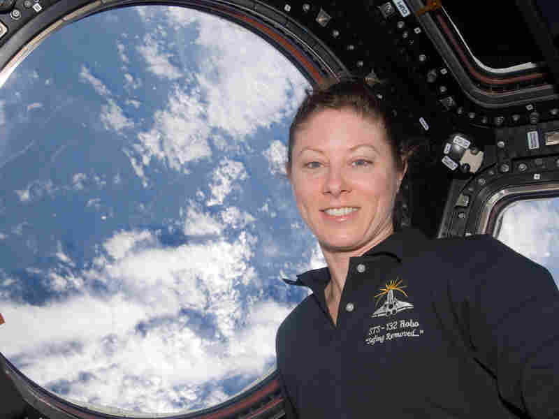 View of Tracy Caldwell Dyson, Expedition 23 Flight Engineer (FE), posing at window in the Cupola Module. Photo was taken during Expedition 23 / STS-132 Joint Operations.