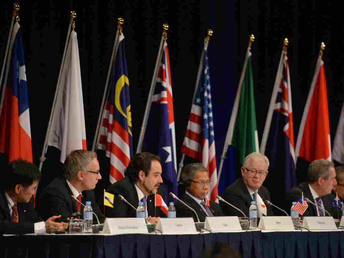 Trade representatives attend a press conference for the Trans-Pacific Partnership.